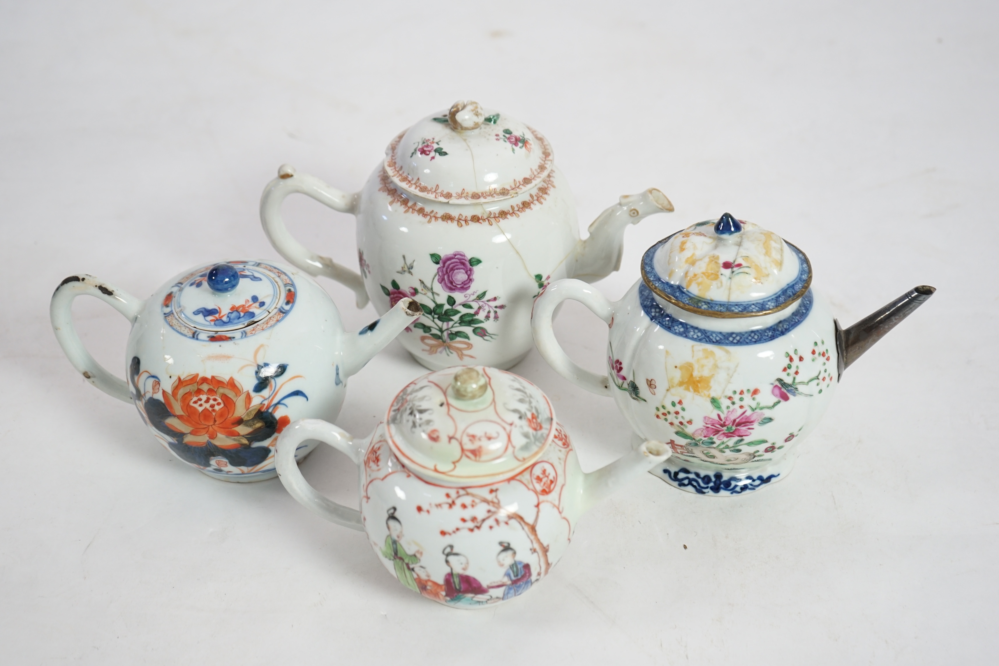 Four 18th century Chinese export polychrome decorated teapots and covers